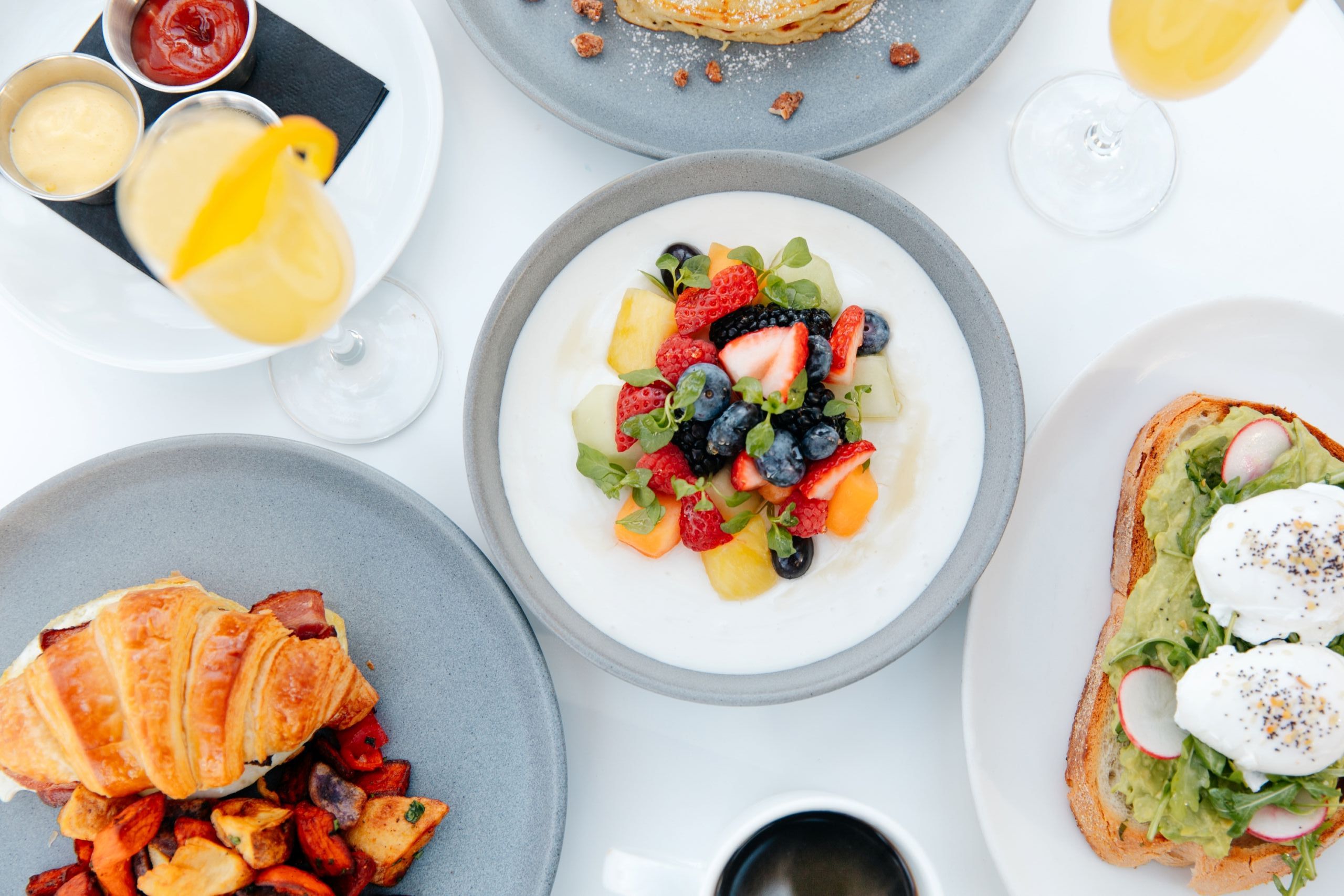 A table set with various breakfast dishes