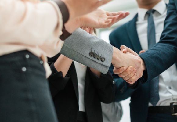 close up. business partners shaking hands in the office