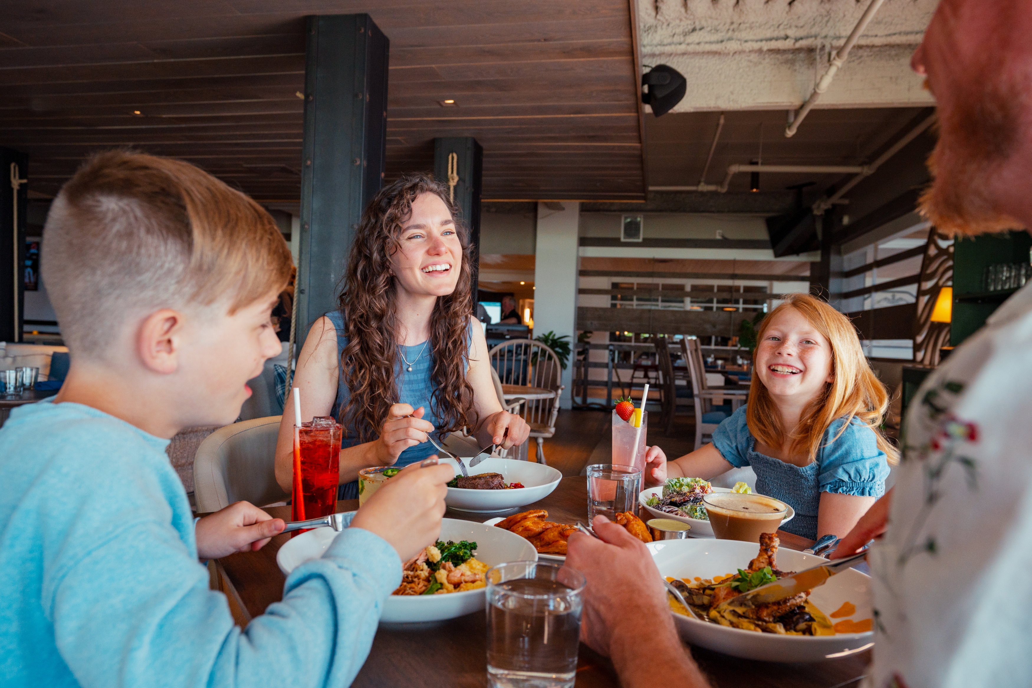 A family of four sitting at a table eating